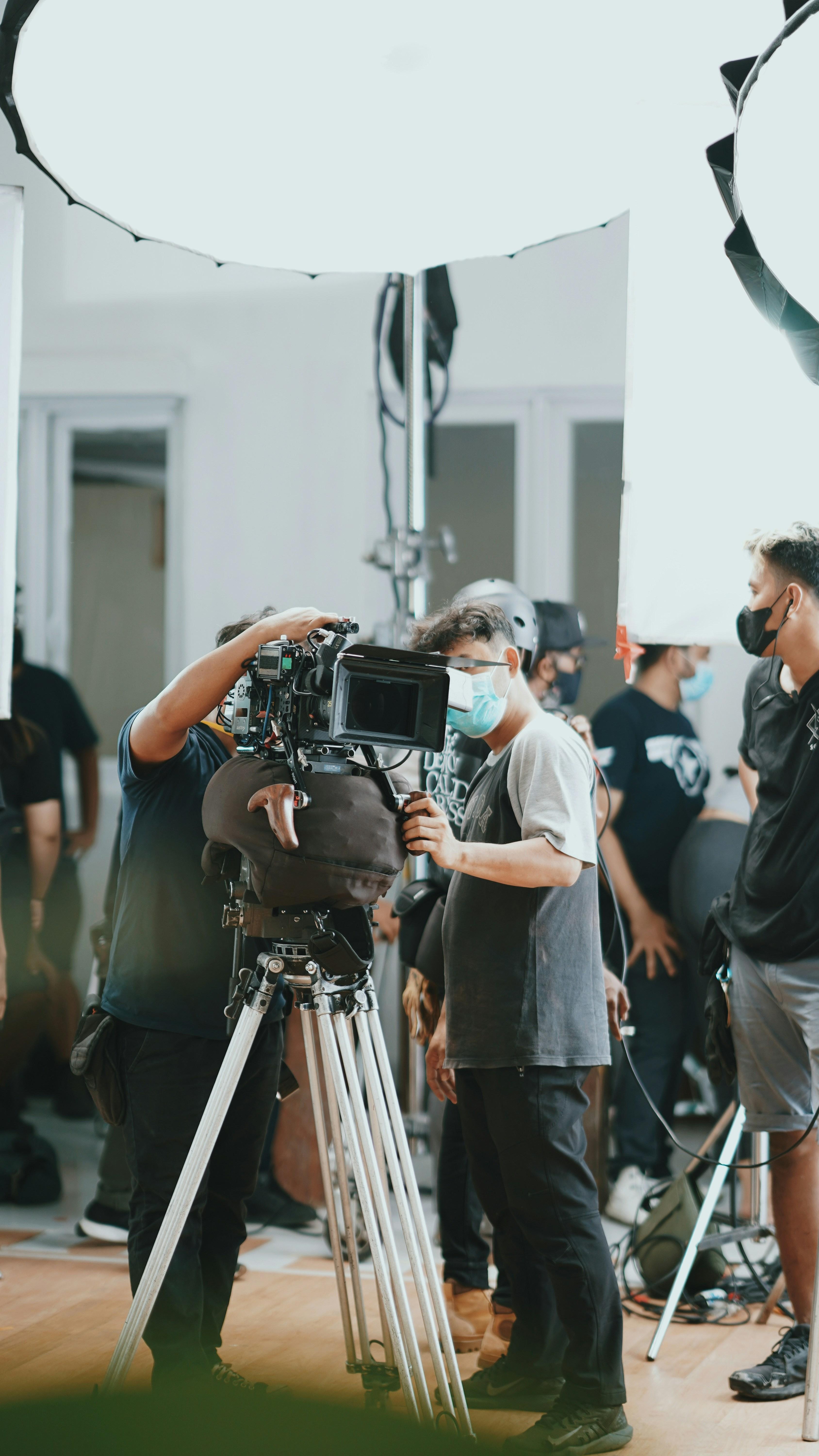 Film crew working on a cinematic production with professional equipment